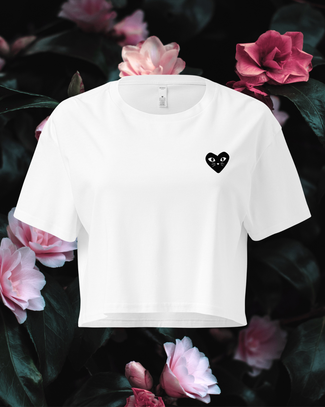 Cropped white t-shirt with a black heart kitten design on a floral background