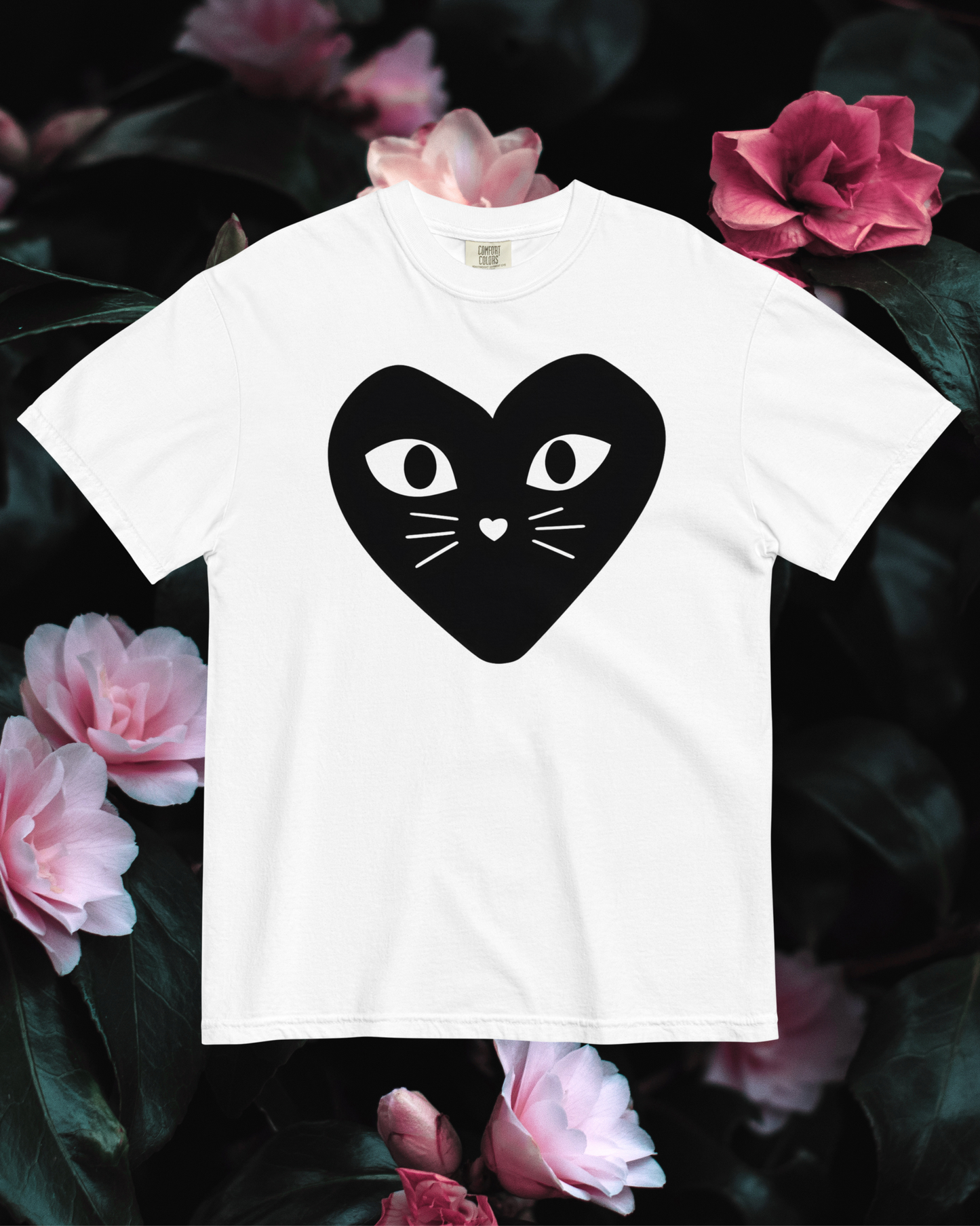 White cotton cat t-shirt with black heart logo featuring kitten whiskers, nose, and eyes, Maison Kitn parody design inspired by Comme des Garçons Play