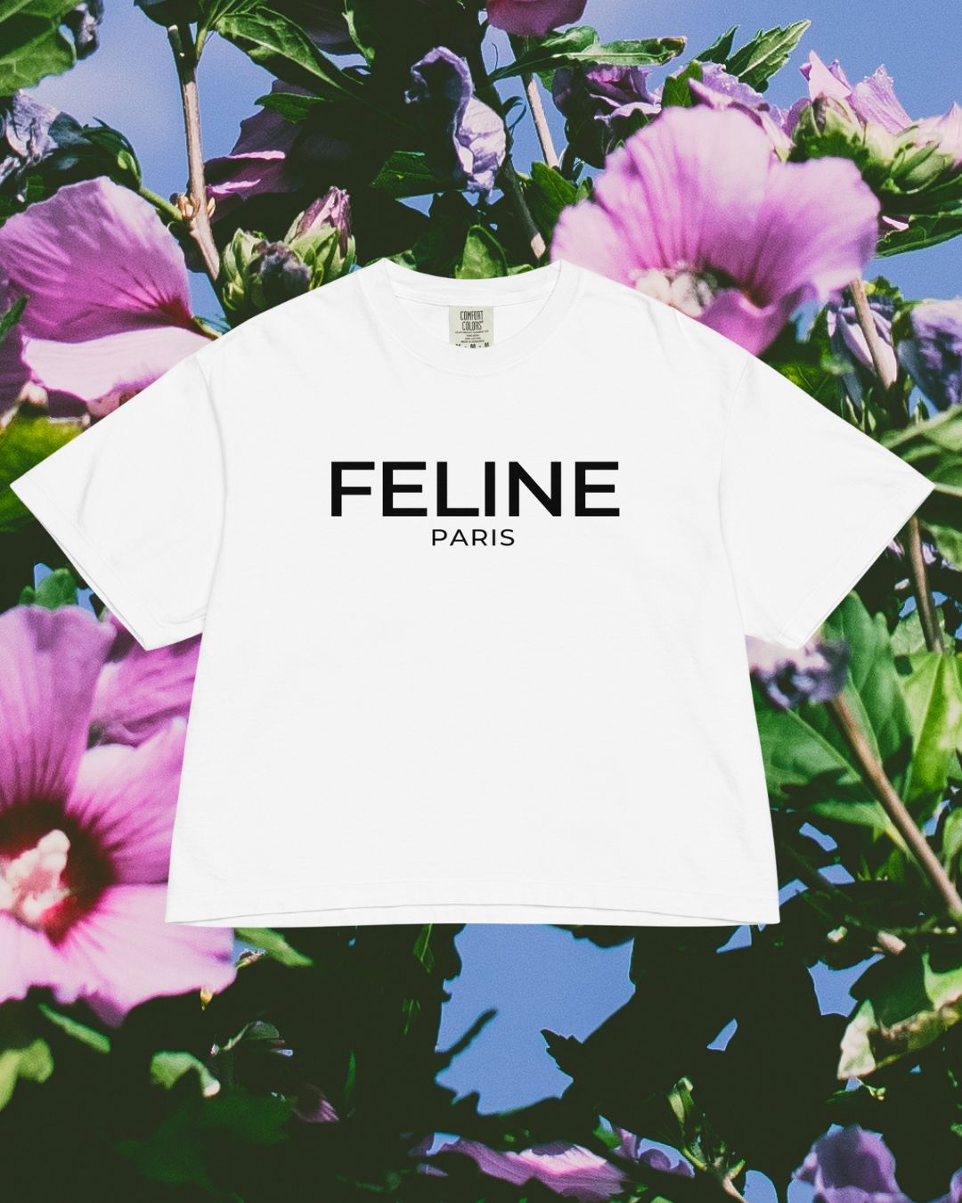 White t-shirt with 'FELINE PARIS' text on a floral background