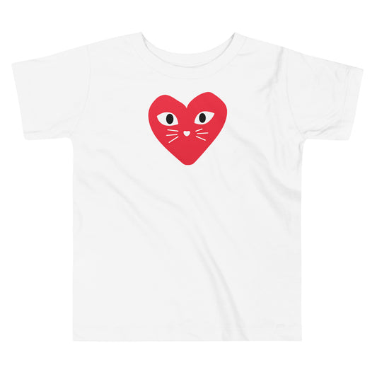 White t-shirt with a red heart design featuring cat eyes and whiskers on a white background