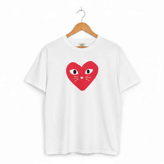 White t-shirt with a red heart design featuring eyes and a mouth on a white background