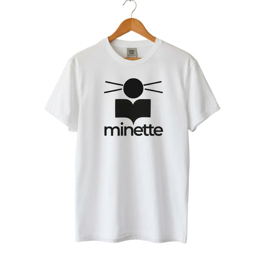 White t-shirt with black logo and 'minette' text on a white background