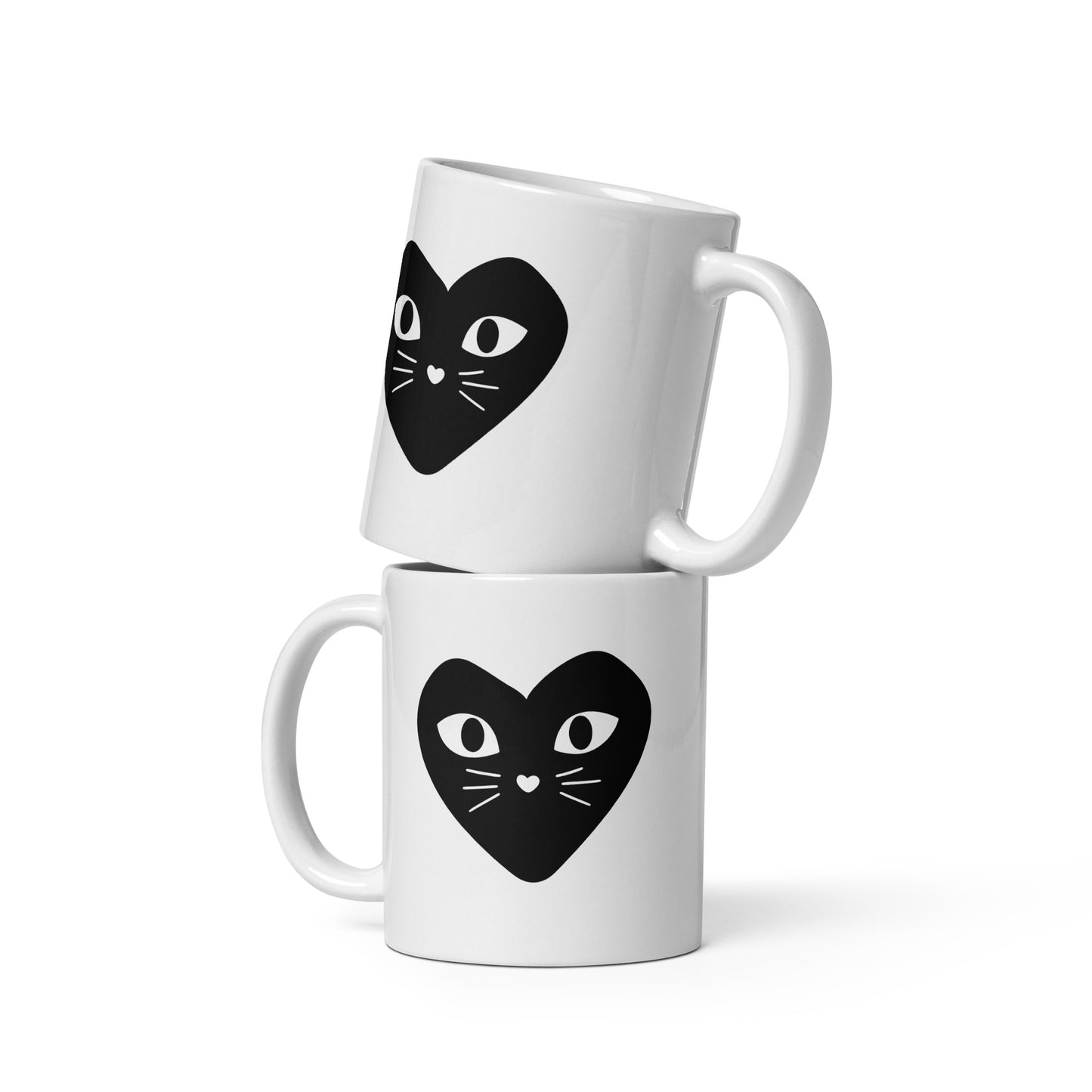 Two white mugs with black heart-shaped cat designs on a white background