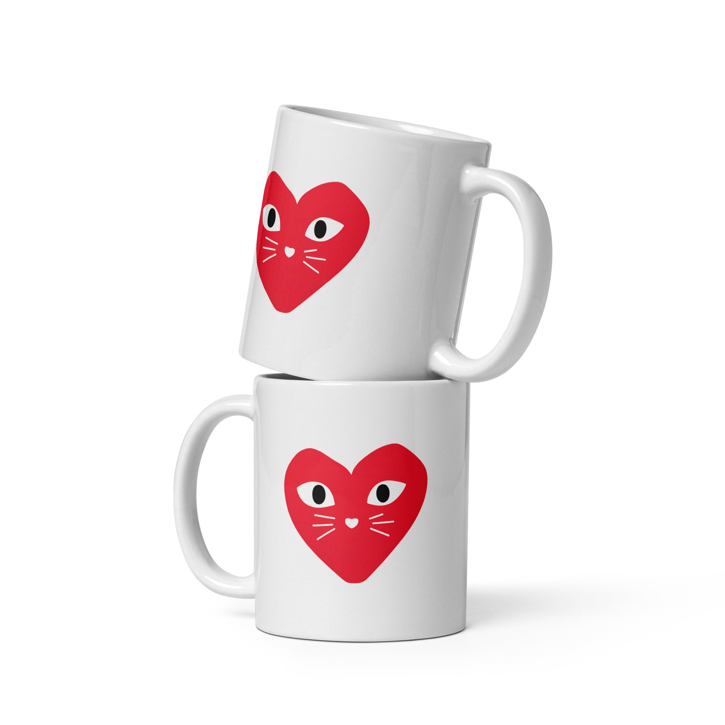Two white mugs with red heart designs featuring cat faces on a white background