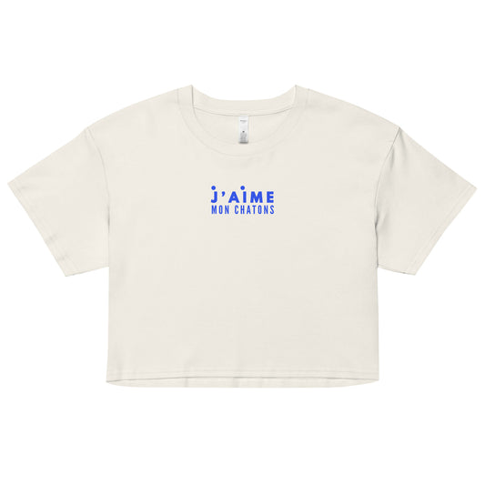 White crop top with blue text on a white background