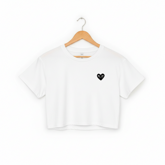 Cropped white cotton cat t-shirt with red heart kitten logo featuring whiskers and eyes, Maison Kitn parody design inspired by Comme des Garçons.