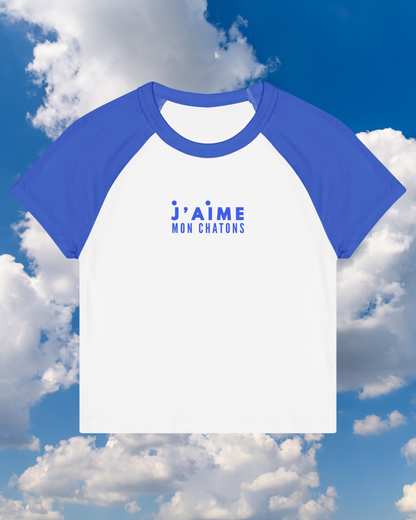 Blue and white baseball shirt with 'j'aime mon chatons' text against a cloudy sky background