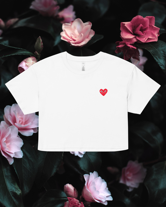 White t-shirt with a red heart kitten design on a floral background