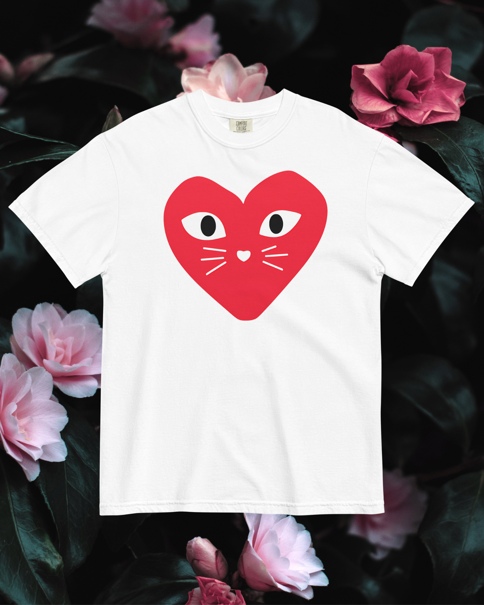 White cotton cat t-shirt with red heart logo featuring kitten whiskers, nose, and eyes, Maison Kitn parody design inspired by Comme des Garçons Play.