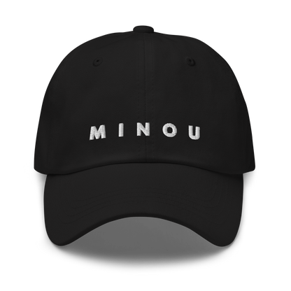 Black cap with 'MINOU' text on a white background