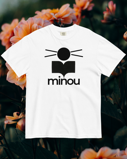 White t-shirt with black logo and 'minou' text on a floral background