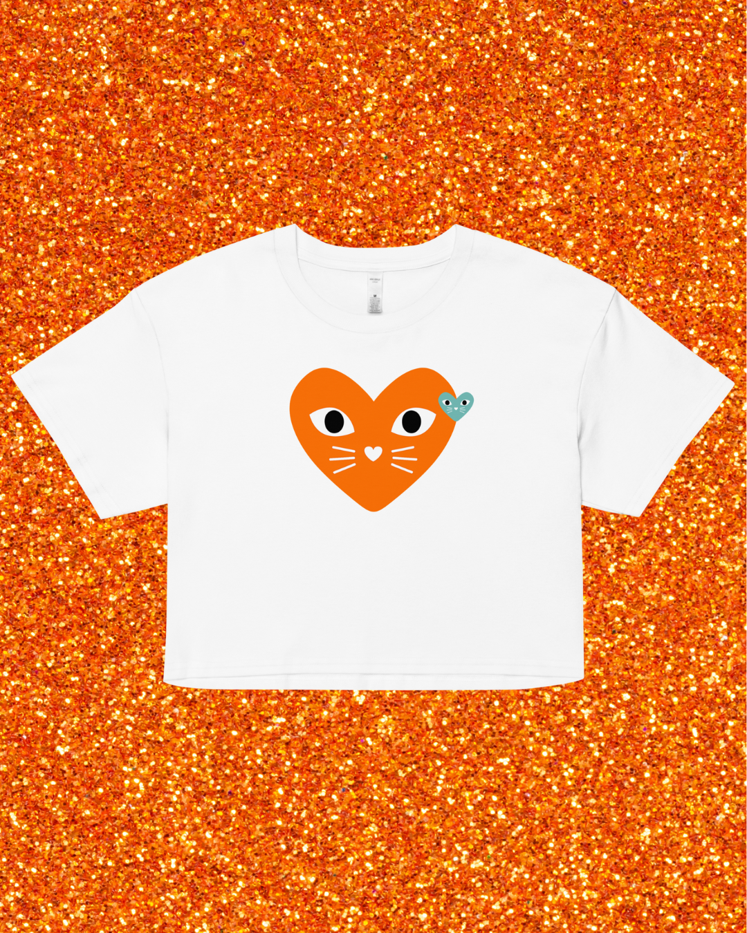 White t-shirt with a heart-shaped cat design on an orange glittery background