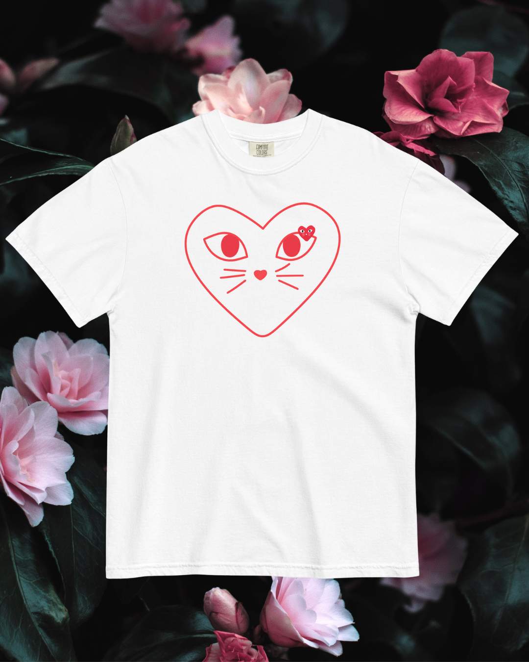 White t-shirt with red heart design featuring cat ears and eyes on a floral background