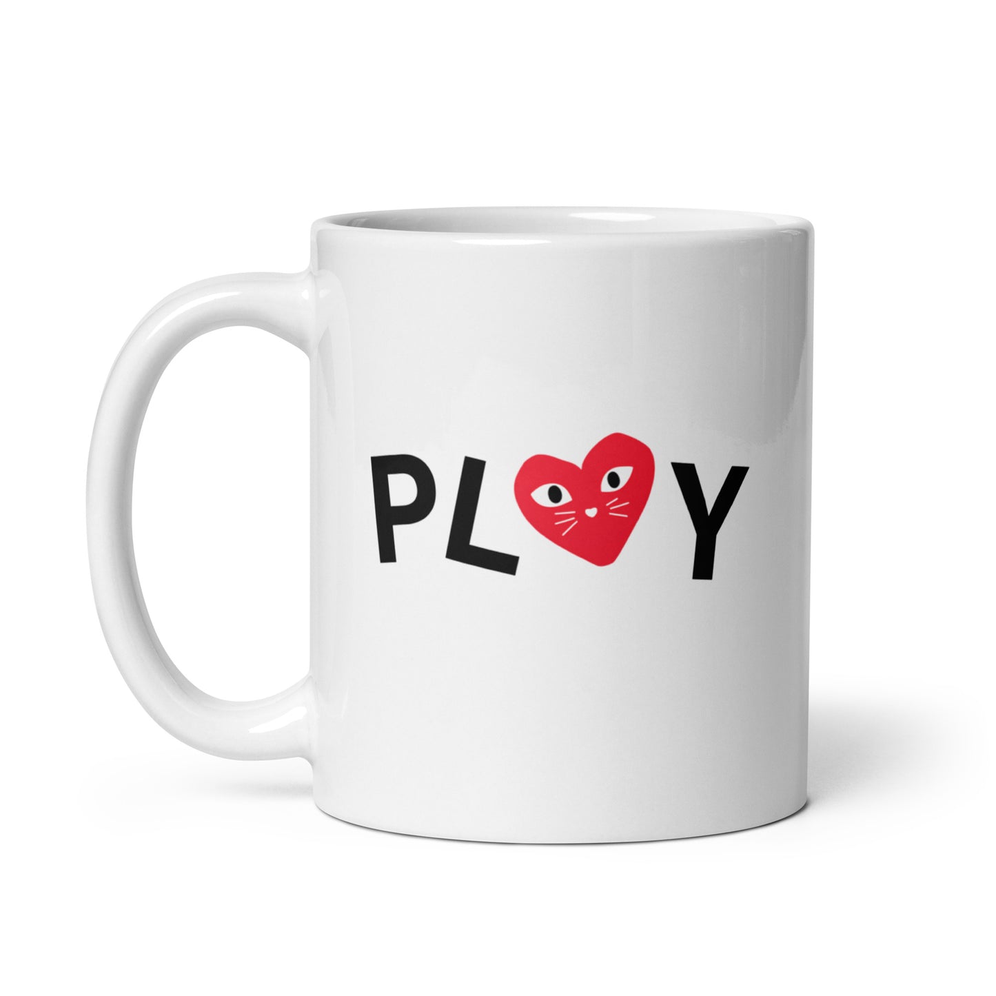 White mug with 'PLAY' text and a red heart design on a white background