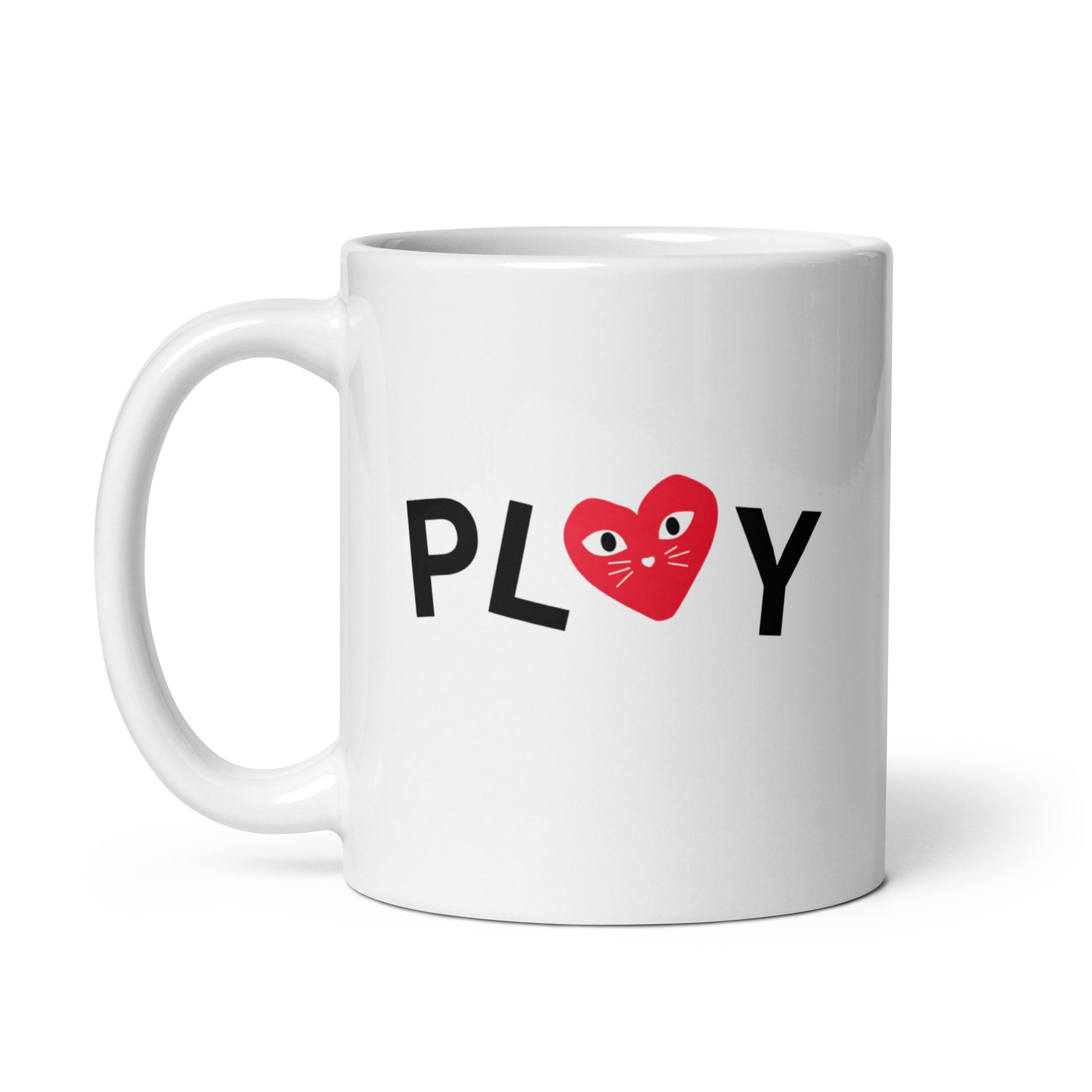 White mug with 'PLAY' text and a red heart design on a white background