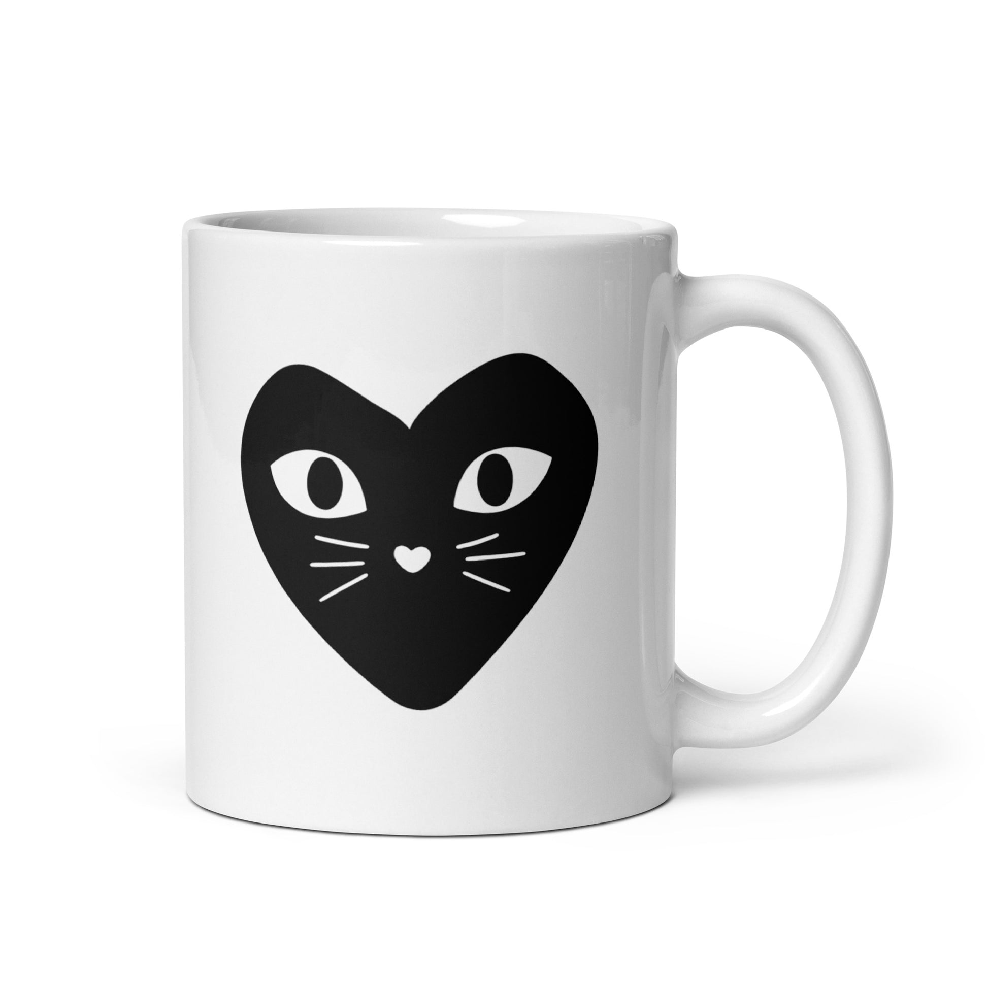 White mug with a black heart-shaped cat face design on a white background