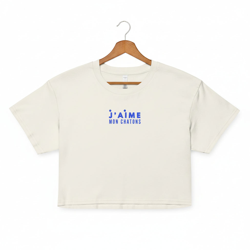 White crop top with blue text on a white background
