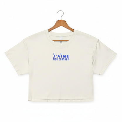 White crop top with blue text on a white background