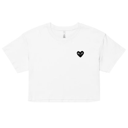 Cropped white cotton cat t-shirt with red heart kitten logo featuring whiskers and eyes, Maison Kitn parody design inspired by Comme des Garçons.