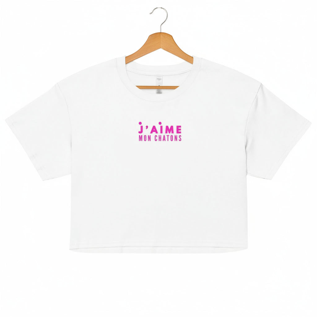 White t-shirt with pink text on a white background
