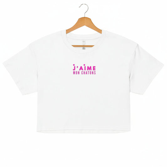 White t-shirt with pink text on a white background