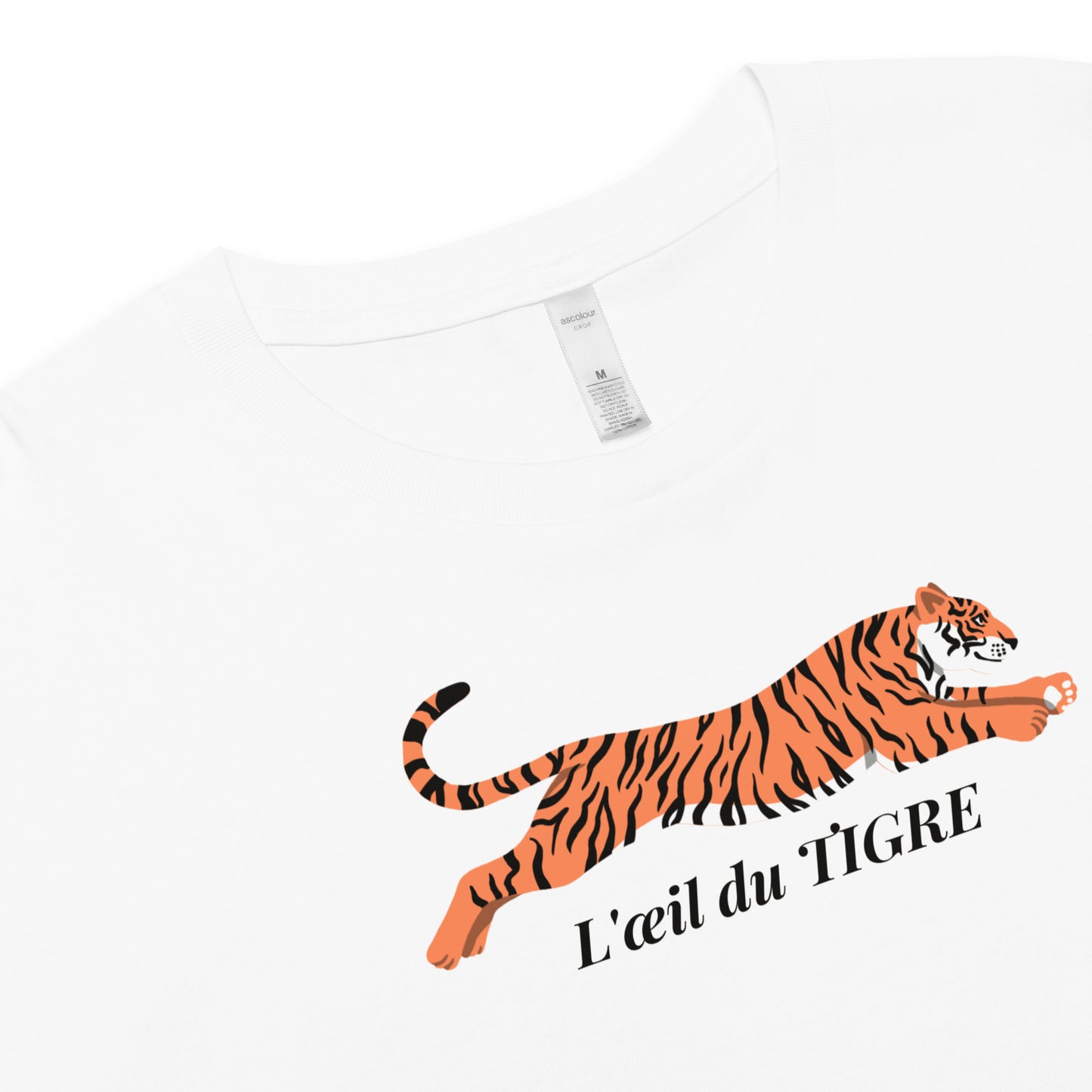 White t-shirt with a tiger graphic and 'L'oeil du Tigre' text on a white background