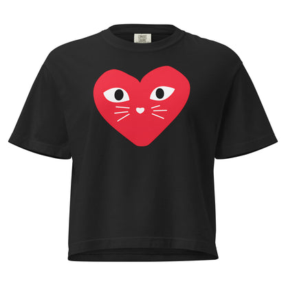 Black t-shirt with a red heart design featuring eyes and a mouth on a white background