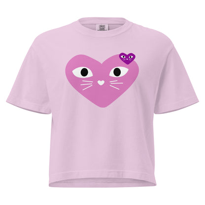 Pink t-shirt with a heart-shaped cat face design on a white background