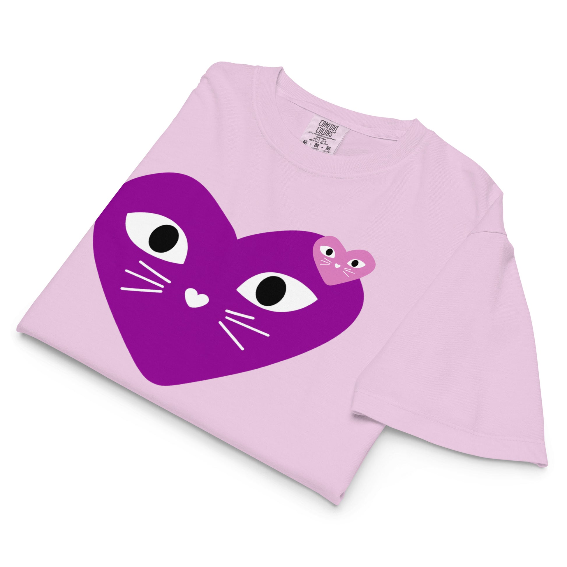 Pink shirt with a purple heart-shaped cat design on a white background