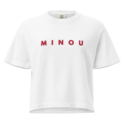 White t-shirt with 'MINOU' printed in red on a white background