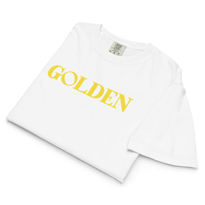White t-shirt with 'GOLDEN' text in yellow on a white background